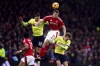 Southampton's Jan Bednarek, top left, and Nottingham Forest's Chris Wood battle for the ball during the English Premier League soccer match between Nottingham Forest and Southampton at the City Ground, Nottingham, England, Sunday, Jan. 19, 2025. (Mike Egerton/PA via AP)