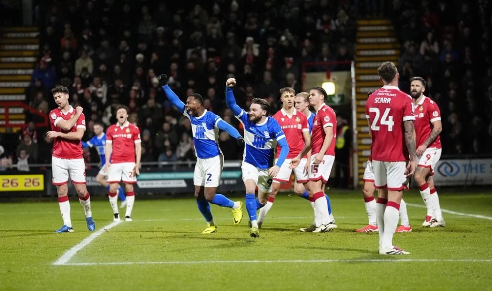 Birmingham City's Alfie May celebrates their side's first goal of the game after Birmingham City's Lyndon Dykes scored their first goal, during the English Football League One soccer match between Wrexham and Birmingham City at the SToK Racecourse, in Wrexham, Wales, Thursday, Jan. 23, 2025. (Nick Potts/PA via AP)