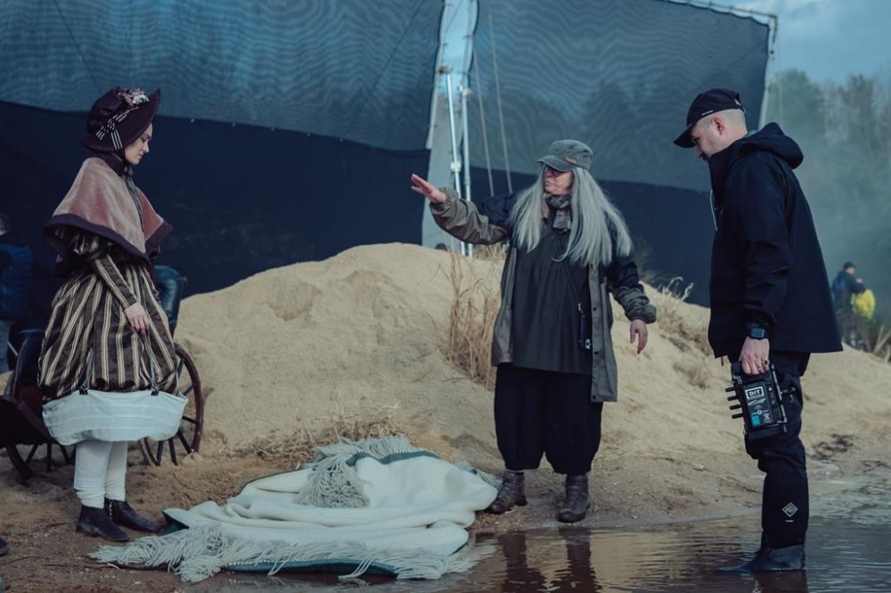 Actor Lily-Rose Depp, costume designer Linda Muir and director Robert Eggers on the set of their Focus Features release,