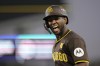FILE - San Diego Padres' Jurickson Profar celebrates after hitting a bunt single during the sixth inning in Game 2 of a baseball NL Division Series against the Los Angeles Dodgers, Sunday, Oct. 6, 2024, in Los Angeles. (AP Photo/Mark J. Terrill, File)