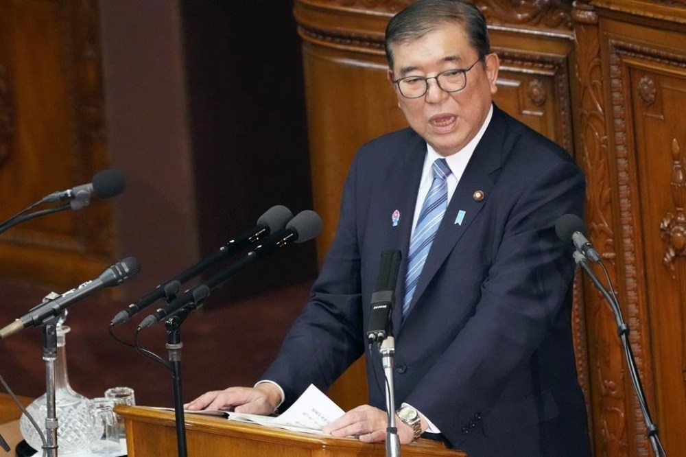 Japan's Prime Minister Shigeru Ishiba delivers a policy speech marking the start of this year's parliamentary session in Tokyo, Friday, Jan. 24, 2025. (AP Photo/Eugene Hoshiko)