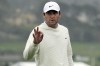 FILE - Scottie Scheffler gestures on the 18th green at Pebble Beach Golf Links during the third round of the AT&T Pebble Beach National Pro-Am golf tournament in Pebble Beach, Calif., Saturday, Feb. 3, 2024. (AP Photo/Ryan Sun, File)
