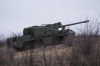A Ukrainian self-propelled howitzer Dita of Azov brigade rides to firing position to open fire towards Russian positions at frontline in Donetsk region, Ukraine, Thursday Jan. 23, 2025. (AP Photo/Evgeniy Maloletka)