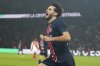 PSG's Khvicha Kvaratskhelia celebrates after scoring his sides second goal during the French League One soccer match between Paris Saint-Germain and Monaco at Parc des Princes stadium in Paris, Friday, Feb. 7, 2025. (AP Photo/Michel Euler)