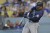 FILE - Seattle Mariners' Jorge Polanco singles in two runs during the first inning of a baseball game against the Los Angeles Dodgers, Aug. 20, 2024, in Los Angeles. (AP Photo/Jayne-Kamin-Oncea, File)
