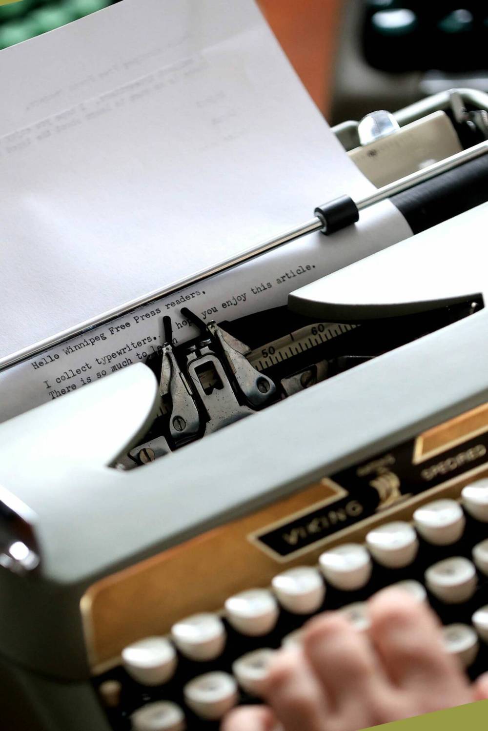 Corah Enns demonstrates skills on an Eaton’s Viking typewriter in her collection. (Ruth Bonneville / Free Press)