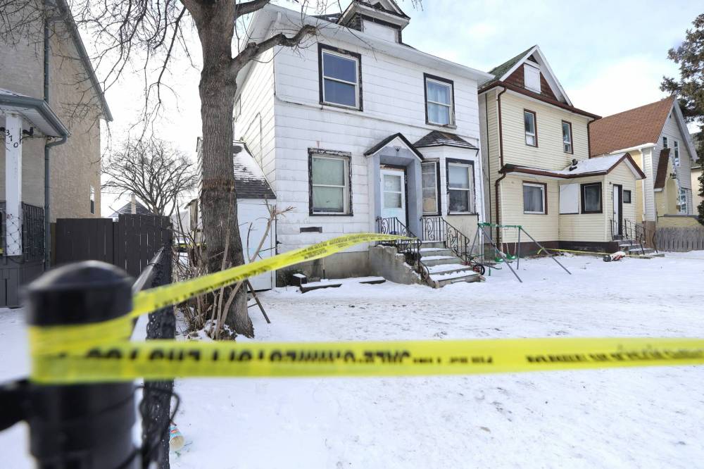 Winnipeg police investigate a homicide on Magnus Avenue in February 2024. (Ruth Bonneville / Free Press files)