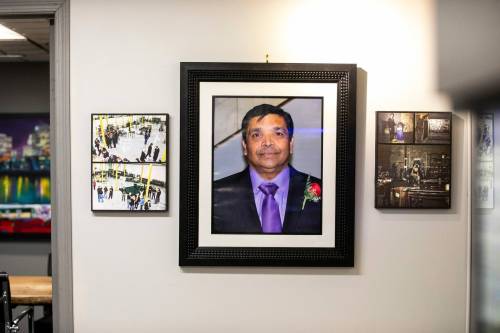 MIKAELA MACKENZIE / FREE PRESS 	 Photos of founder Rajakulasingam "Ray" Kulathungam hang in the office at SCT Welding in Winnipeg on Friday, Dec. 27, 2024. For Aaron story. Winnipeg Free Press 2024