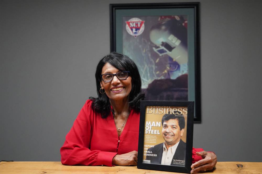 SUPPLIED
Ranjini Kulathungam, owner of SCT Welding, Laser and Manufacturing Co., is pictured holding an October 2003 issue of Manitoba Business magazine featuring her late husband, Raj Kulathungam, on the cover.