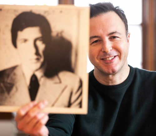MIKAELA MACKENZIE / FREE PRESS Finance minister Adrien Sala and his record collection in Winnipeg on Monday, Dec. 30, 2024. For Ben Waldman story. Winnipeg Free Press 2024
                                Sala with Leonard Cohen&rsquo;s New Skin for the Old Ceremony.
