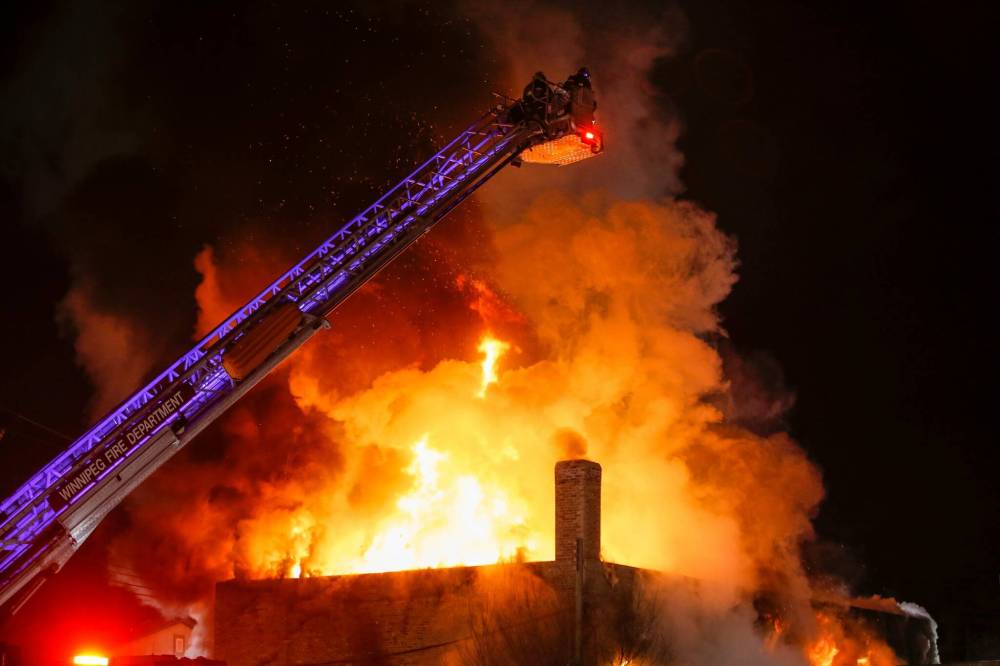 JOHN WOODS / FREE PRESS
Firefighters battle a blaze at Holy Ascension Greek Orthodox Church at 197 Euclid Avenue in Winnipeg Monday evening.