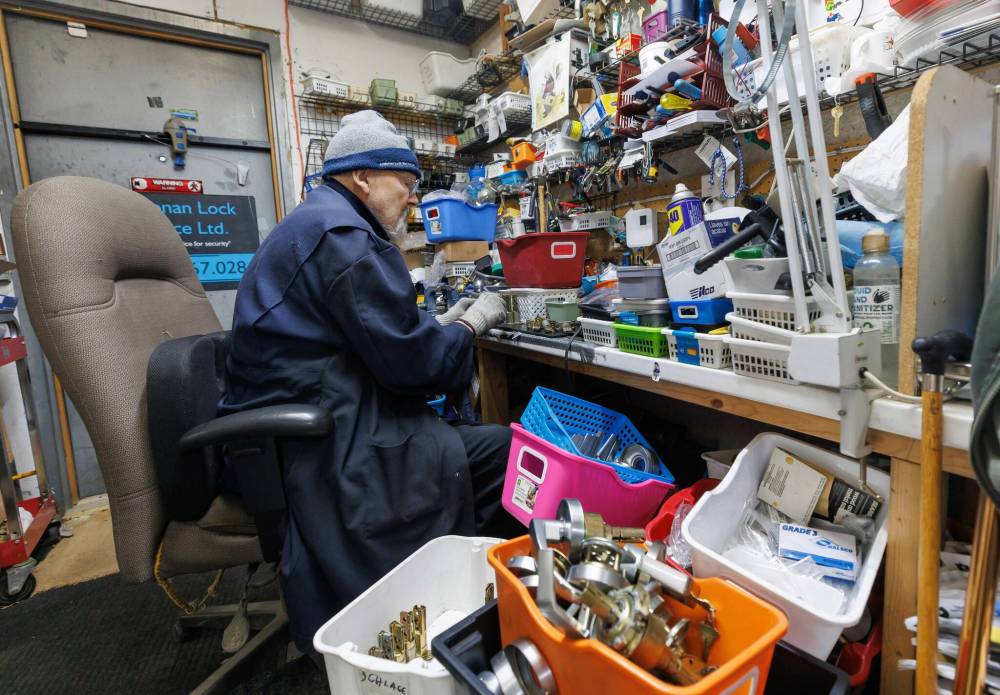 MIKE DEAL / FREE PRESS
Ron Dawson, 81, owner of Kildonan Lock Service which he started in 1970, sorts parts in the back room.