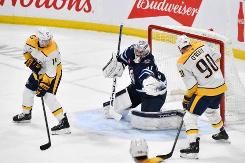 Fred Greenslade / THE CANADIAN PRESS
                                Winnipeg Jets goaltender Connor Hellebuyck makes one of his 26 saves in his 300th career on Tuesday night.
