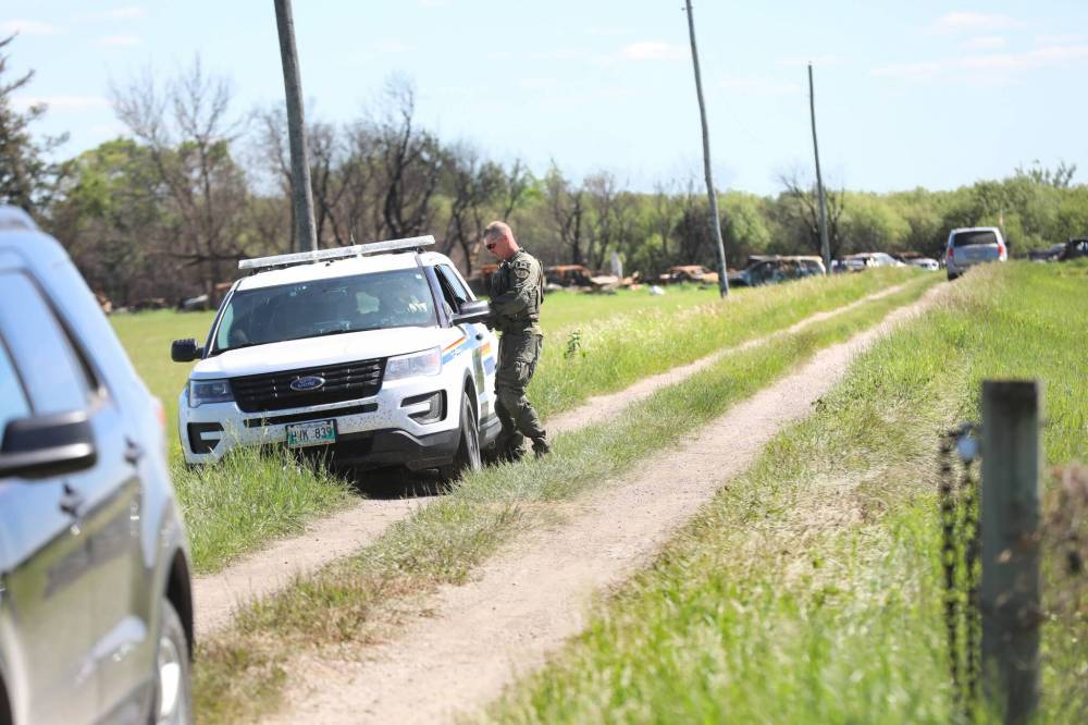 RUTH BONNEVILLE / FREE PRESS FILES
                                RCMP investigators search for evidence on Eric Wildman’s property for his connection with the homicide of Clifford Joseph in 2021. Wildman and Joseph lived on neighbouring properties near Stead, about 90 kilometres northeast of Winnipeg.