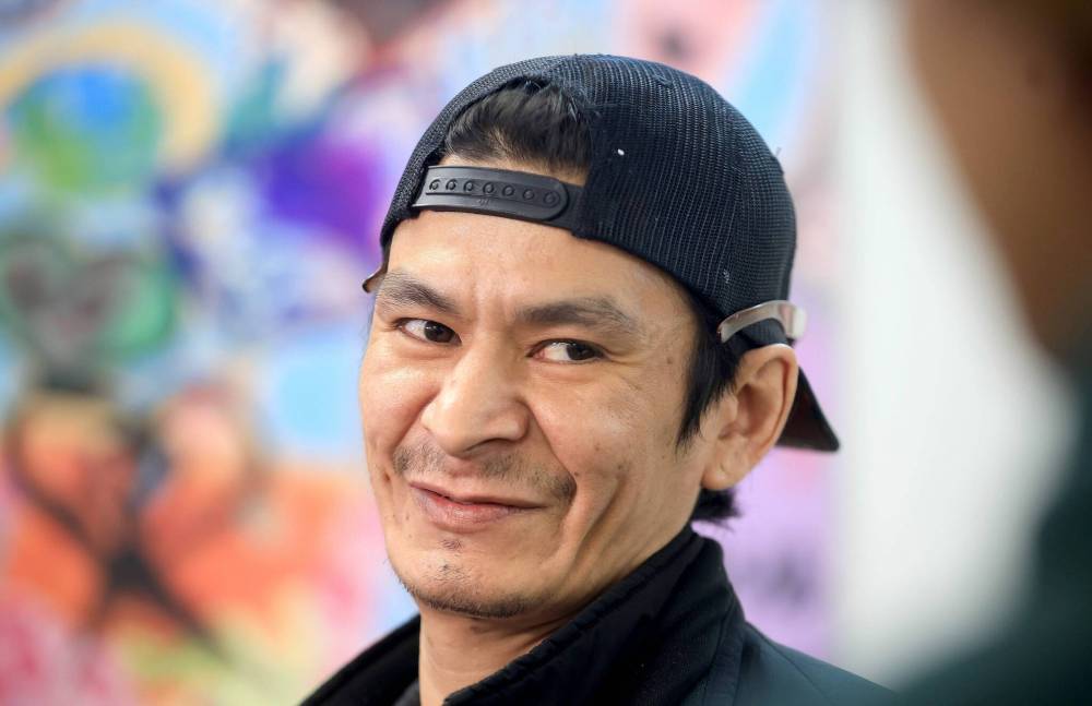 RUTH BONNEVILLE / FREE PRESS
Artist Jedrick Thorassie said his paintings aim to reflect life in the North End and to inspire people.