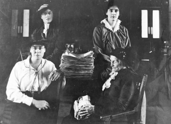 From left: Dr. Mary Crawford, Lillian Beynon Thomas, Winona Flett Dixon and Amelia Burritt with the PEL petition in 1915. (Archives of Manitoba)