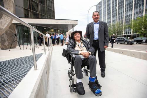 MIKAELA MACKENZIE / FREE PRESS FILES
                                Allan Woodhouse (left) and Brian Anderson pose for a photo after exiting the Law Courts as innocent men in July 2023.