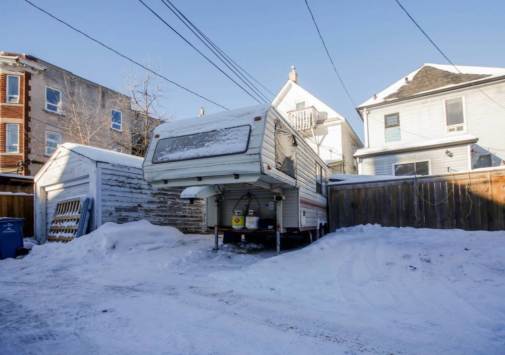 JOHN WOODS / FREE PRESS
People living in an RV parked beside a garage behind 48 Fawcett Ave. have been asked to vacate.