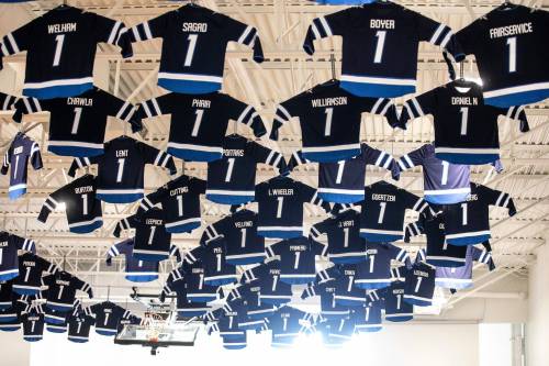 MIKAELA MACKENZIE / FREE PRESS
                                Jerseys hang from the gymnasium of the Bruce Oake Recovery Centre as a tribute to clients on the first anniversary of their sobriety. 
