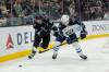 Melissa Majchrzak / The Associated Press
                                Utah Hockey Club right winger Josh Doan, left, pursues the puck against Winnipeg Jets defenceman Neal Pionk during the first period of their game Monday, in Salt Lake City.