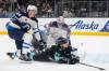 Lindsey Wasson / The Associated Press files
                                Jets defenceman Logan Stanley ties up Kraken forward Jaden Schwartz in front of Connor Hellebuyck’s net.