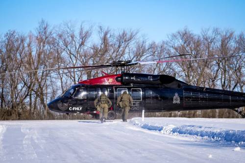 RCMP PHOTO 
                                The RCMP Federal Policing Northwest Region has increased security by adding regular Black Hawk helicopter flights along the Manitoba border with the United States. The first of these regular flights began on Sunday.