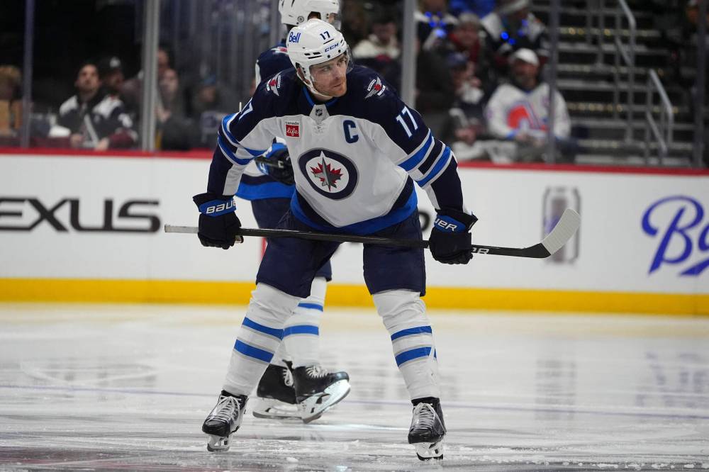 David Zalubowski / The Associated Press files
The Jets will miss captain Adam Lowry as he recovers from an injury suffered Monday against the Utah Hockey Club.