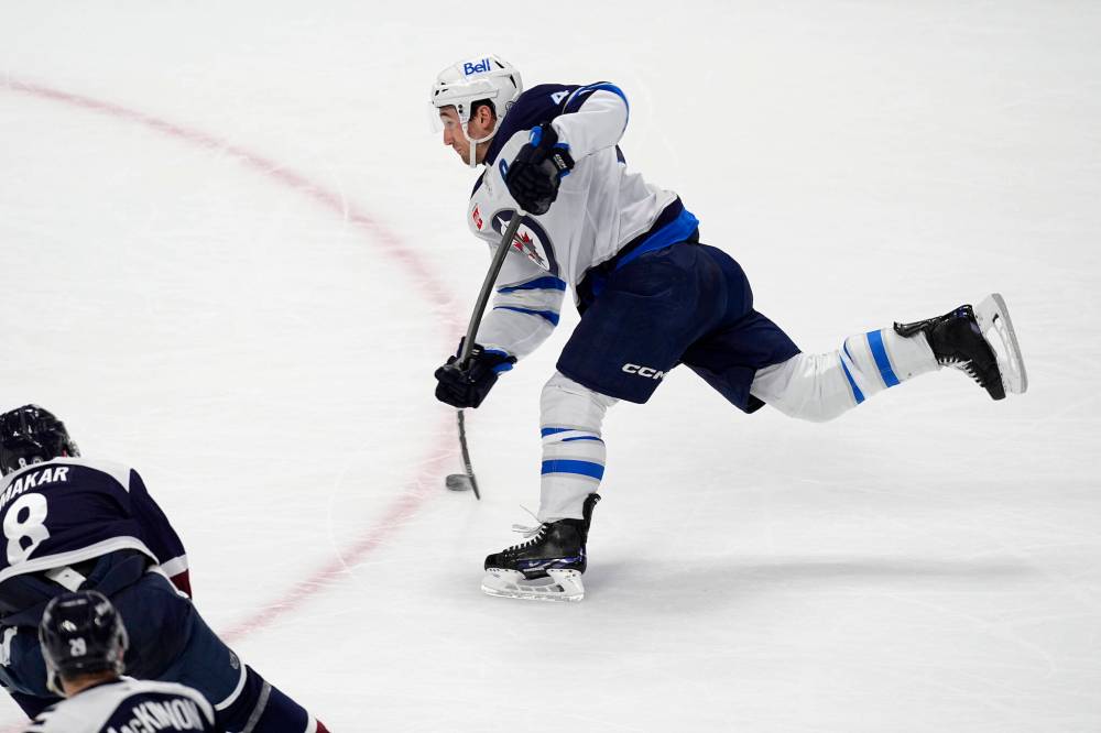DAVID ZALUBOWSKI / THE ASSOCIATED PRESS
Jets defenceman Neal Pionk unloads in overtime to score the game-winning goal Wednesday against the Colorado Avalanche.