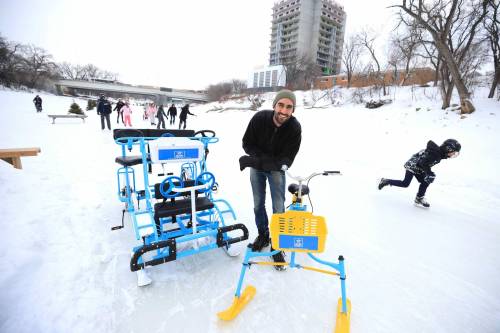 RUTH BONNEVILLE / FREE PRESS BIZ - Ice Cycles Photo of Sinan Leylek, owner of Ice Cycles, as he demonstrates how to use his bicycles on the river trail Friday. Story: Sinan Leylek , founder of Spark Rentals and Ice Cycles. Ice Cycles rents and sells bikes designed to travel on ice. Jan 24th,, 2025