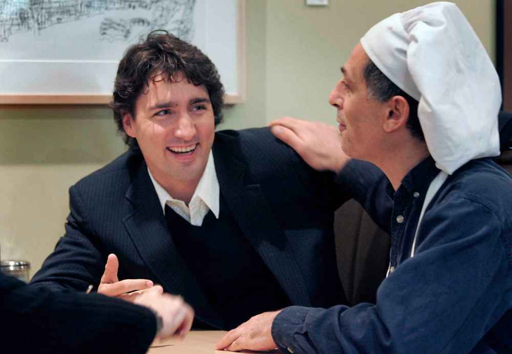 Trudeau, then an MP, visits with Ami Hassan at the Falafel Place restaurant during a breakfast meeting in 2009. (Wayne Glowacki / Free Press files)