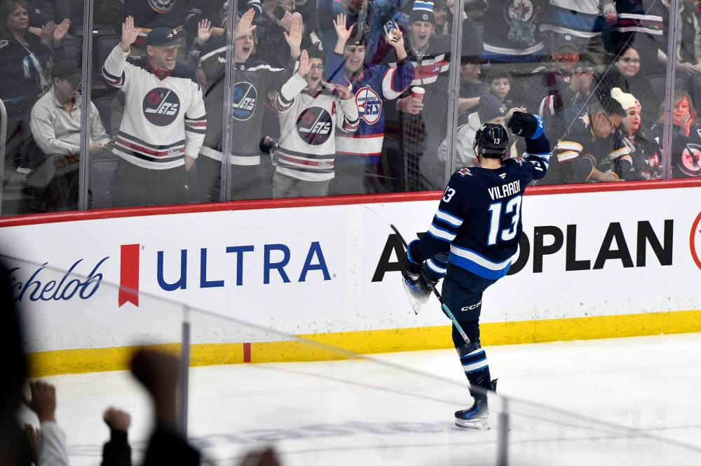 FRED GREENSLADE / THE CANADIAN PRESS
Winnipeg Jets’ Gabriel Vilardi celebrates one of his two goals against the Calgary Flames on Sunday.