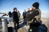 MIKAELA MACKENZIE / FREE PRESS
                                Premier Wab Kinew chats with conservation officers near Emerson after making the announcement that Manitoba Conservation Officers will be patrolling the Canada-U.S. border, Monday.