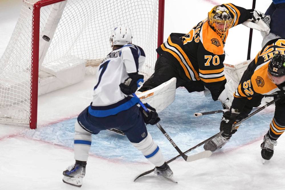 Charles Krupa / The Associated Press
Winnipeg Jets’ Vladislav Namestnikov buries a backhand shot for a goal against Bruins goaltender Joonas Korpisalo in the first period Thursday in Boston.