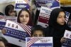 FILE - Afghan refugees hold placards during a meeting to discuss their situation after President Donald Trump paused U.S. refugee programs, in Islamabad, Pakistan, Jan. 24, 2025. (AP Photo/Anjum Naveed, File)