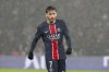 PSG's Khvicha Kvaratskhelia stands on the pitch during the French League One soccer match between Paris Saint-Germain and Reims at Parc des Princes stadium in Paris, Saturday, Jan. 25, 2025. (AP Photo/Michel Euler)