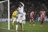 Real Madrid's Jude Bellingham, left, celebrates with his teammate after scoring his side's second goal during the Champions League opening phase soccer match between Brest and Real Madrid at Roudourou stadium in Guingamp, France, Wednesday, Jan. 29, 2025. (AP Photo/Thibault Camus)