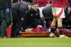 Manchester United's Lisandro Martinez reacts in pain as he lies on a stretcher after an injury during the English Premier League soccer match between Manchester United and Crystal Palace at Old Trafford stadium in Manchester, England, Sunday, Feb. 2, 2025. (AP Photo/Dave Thompson)