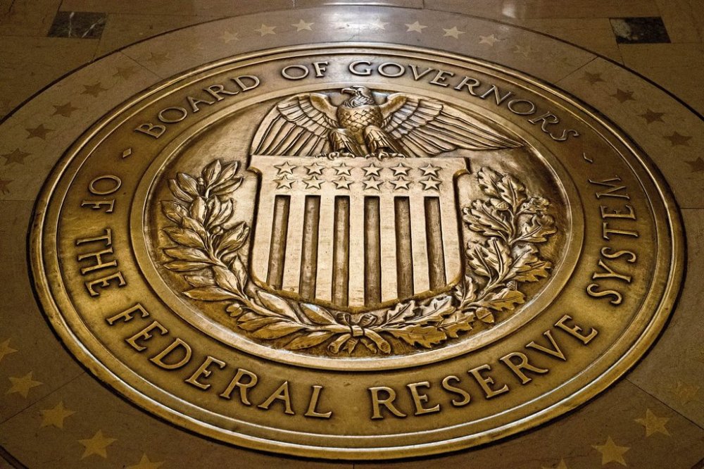 FILE- The seal of the Board of Governors of the United States Federal Reserve System is displayed in the ground at the Marriner S. Eccles Federal Reserve Board Building in Washington, Feb. 5, 2018. (AP Photo/Andrew Harnik, File)