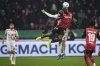 Leverkusen's Victor Boniface, front, and Cologne's Timo Huebers, rear, jump for a head during the German Cup, quarterfinal soccer match between Bayer Leverkusen and FC Cologne at the BayArena in Leverkusen, Germany, Wednesday, Feb. 5, 2025. (AP Photo/Martin Meissner)