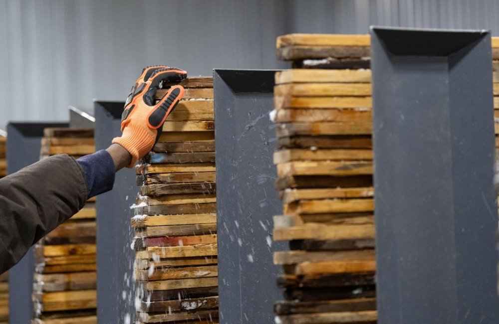 Workers stack and sort softwood lumber at Groupe Crete, a sawmill in Mont-Blanc, Que., Monday, Jan. 20, 2025. Statistics Canada released its January jobs report this morning. THE CANADIAN PRESS/Christinne Muschi