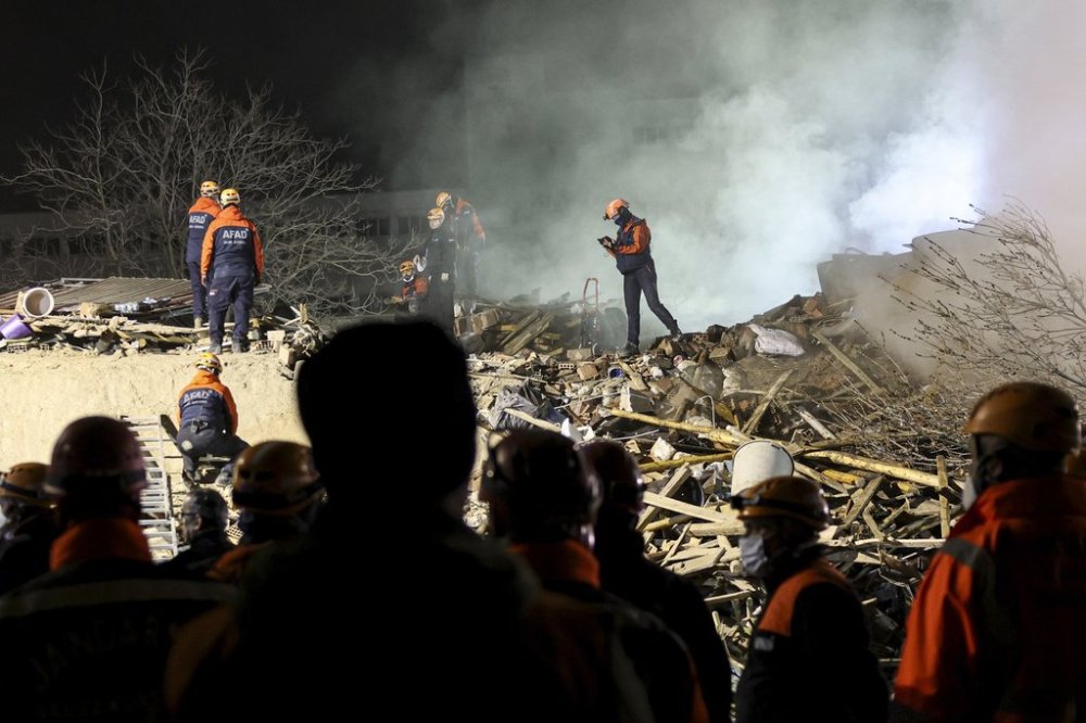 Emergency and rescue team members work in the aftermath of a building that collapsed in the city of Konya, central Turkey, early Saturday, Jan. 25, 2025. (Ugur Yildirim/Dia Photo via AP)