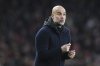 Manchester City's head coach Pep Guardiola gestures during the English Premier League soccer match between Arsenal and Manchester City at the Emirates stadium in London, Sunday, Feb. 2, 2025. (AP Photo/Alastair Grant)