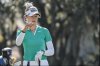 Nelly Korda checks the wind direction on the ninth hole during the first round of the Hilton Grand Vacations Tournament of Champions LPGA golf tournament in Orlando, Fla., Thursday, Jan. 30, 2025. (AP Photo/Kevin Kolczynski)