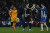 Real Madrid's Kylian Mbappe, left, reacts as Espanyol's goalkeeper Joan Garcia, centre and Urko Gonzalez celebrate Carlos Romero's opening goal during a Spanish La Liga soccer match between Espanyol and Real Madrid at the Lluis Companys Olympic Stadium in Barcelona, Spain, Saturday Feb.1, 2025. (AP Photo/Joan Monfort)