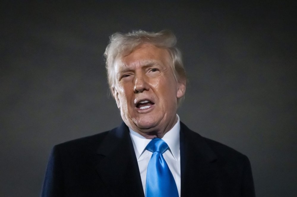 United States President Donald Trump speaks to reporters next to Air Force 1 after arriving back at Joint Base Andrews, Md., Sunday, Feb. 2, 2025. THE CANADIAN PRESS/AP/Ben Curtis
