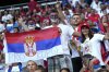 FILE - Fans for Serbia have painted faces and hold a flag in the stands prior to a Group C match between Denmark and Serbia at the Euro 2024 soccer tournament in Munich, Germany, Tuesday, June 25, 2024. (AP Photo/Matthias Schrader, File)
