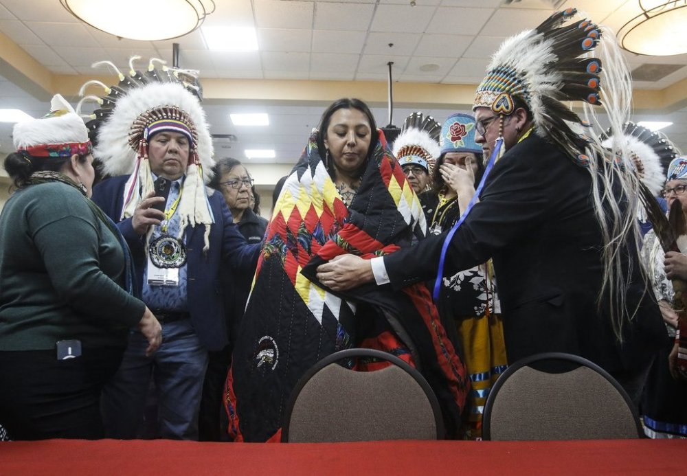 Kyra Wilson takes part in a ceremony after the Assembly of Manitoba Chiefs (AMC) selected her as grand chief in Winnipeg, Wednesday. First Nations leaders selected a new head for the AMC after the sudden death of Cathy Merrick last year. THE CANADIAN PRESS/John Woods