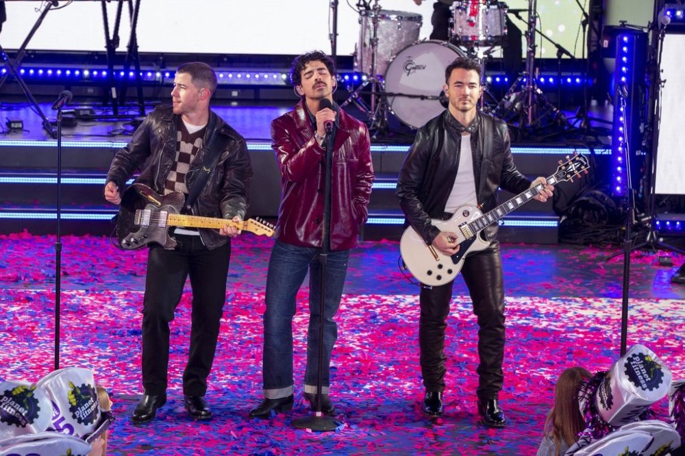 From left, Nick Jonas, Joe Jonas and Kevin Jonas of the Jonas Brothers perform during the Times Square New Year's Eve celebration in New York, Tuesday, Dec. 31, 2024. THE CANADIAN PRESS/AP-Ted Shaffrey