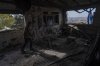 Igor Abramovich surveys heavy damage to a house from the 14-month war between Hezbollah and Israel in Kibbutz Manara, on the border with Lebanon, northern Israel, Jan. 5, 2025. (AP Photo/Ariel Schalit)