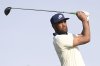 Tony Finau hits a tee shot on the second hole of the South Course at Torrey Pines during the first round of the Farmers Insurance Open golf tournament Wednesday, Jan. 22, 2025, in San Diego. (AP Photo/Denis Poroy)